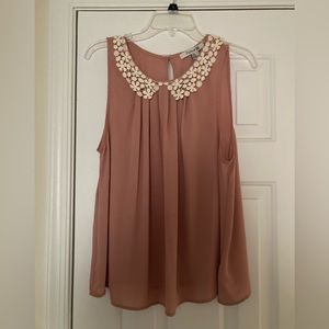 Rose colored sleeveless blouse with lace collar